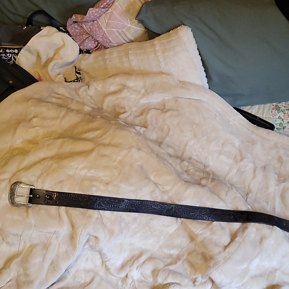 Western style black etched silver buckle belt
